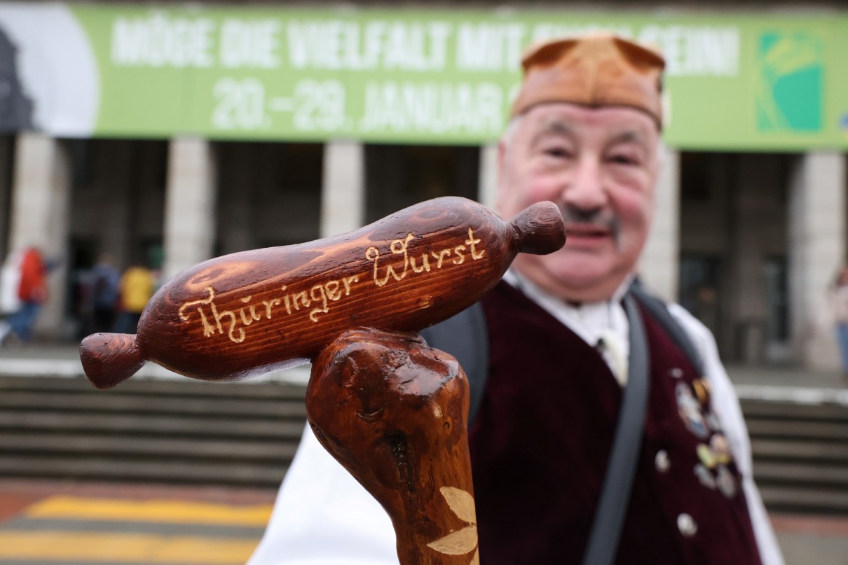 A man holding a Thüringer sausage.