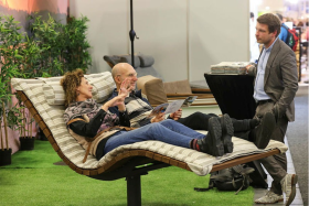Two people test a garden lounger in the Garden, Home & Yard theme world.
